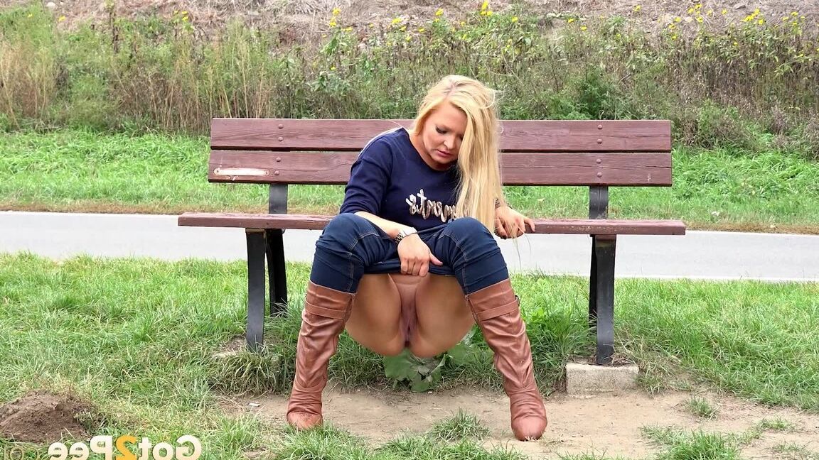 15P Thick blond chick Jenna Lovely squats for a piss next to bench beside the road