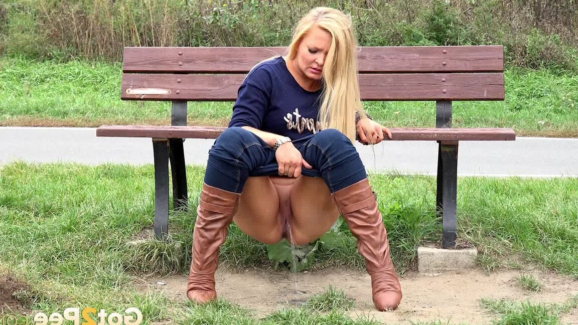 15P Thick blond chick Jenna Lovely squats for a piss next to bench beside the road