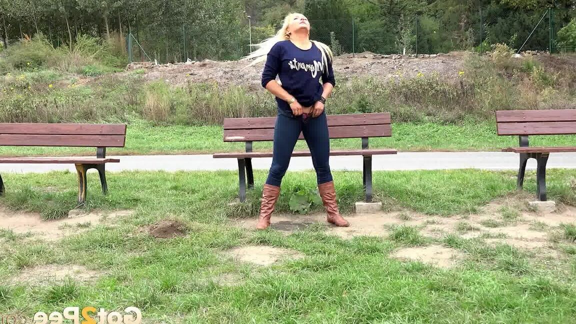 15P Thick blond chick Jenna Lovely squats for a piss next to bench beside the road