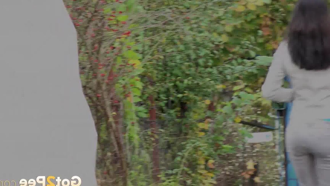 15P Clothed chick AngelAngel pulls down her pants for a piss on a public pathway