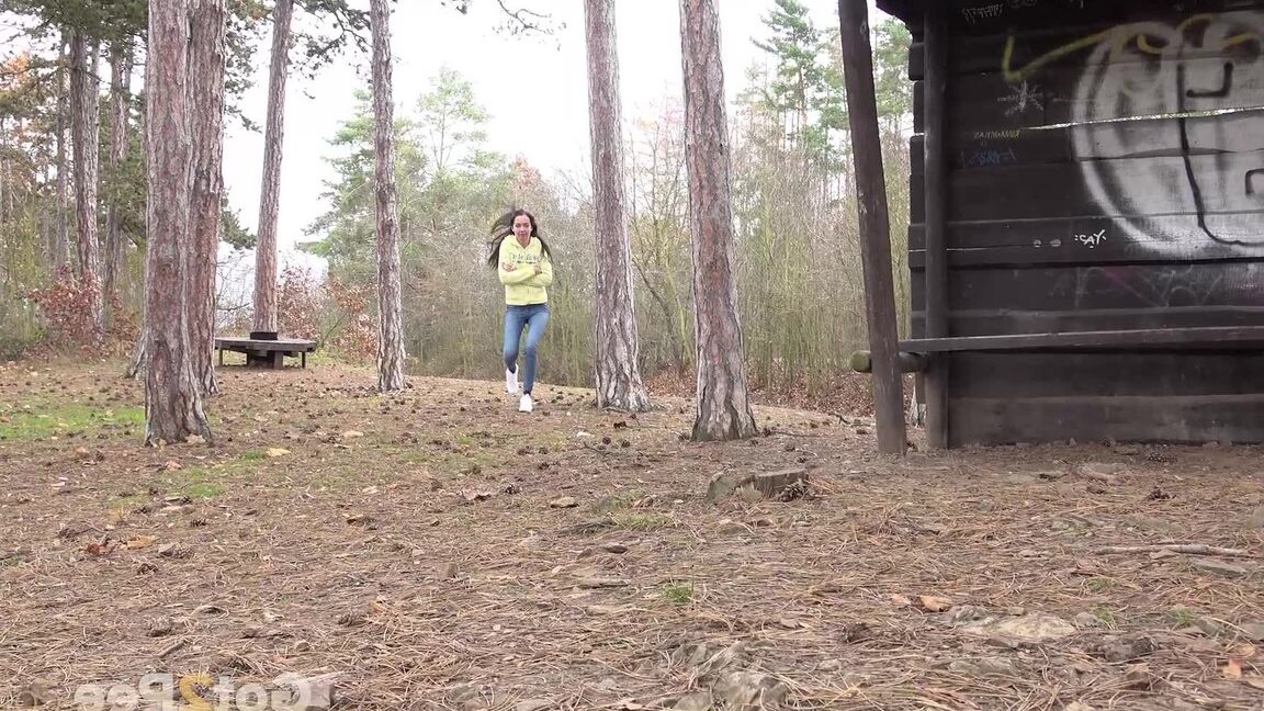 15P Tiny brunette Mistika squats for a piss next to a warming station in the woods