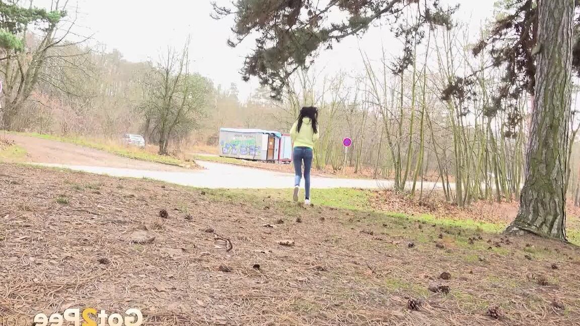 15P Tiny brunette Mistika squats for a piss next to a warming station in the woods