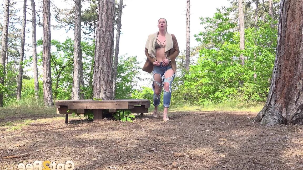15P Solo girl Chrissy Fox takes a piss next to a platform in a forest