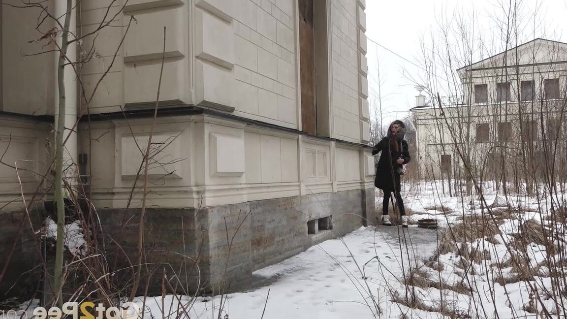 15P Distressed girl pulls down her jeans to pee on snow-covered steps