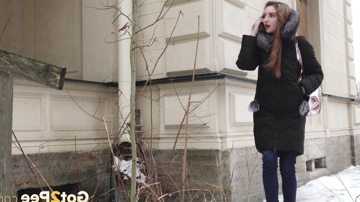 15P Distressed girl pulls down her jeans to pee on snow-covered steps