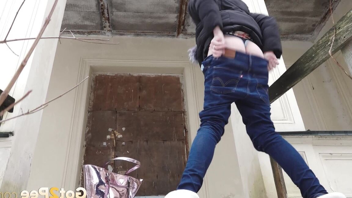 15P Distressed girl pulls down her jeans to pee on snow-covered steps