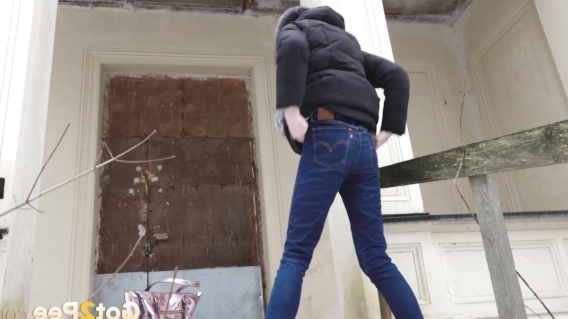 15P Distressed girl pulls down her jeans to pee on snow-covered steps