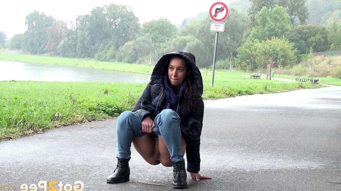 15P Gorgeous dark haired babe pees on the ground