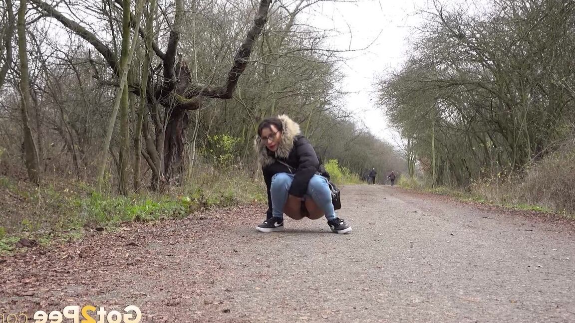 15P Solo girl Natasha Ink squats to pee on a country road while wearing a parka