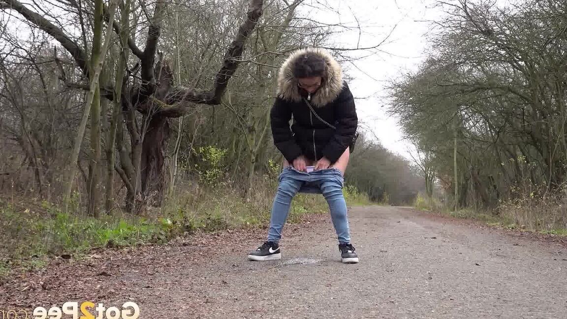 15P Solo girl Natasha Ink squats to pee on a country road while wearing a parka