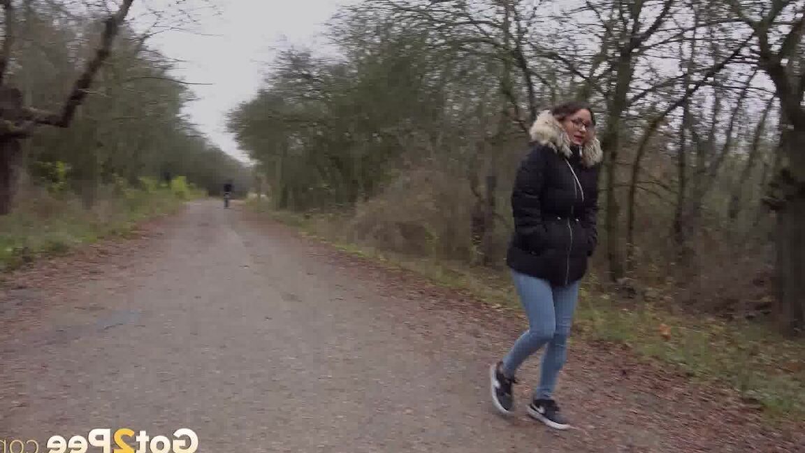 15P Solo girl Natasha Ink squats to pee on a country road while wearing a parka