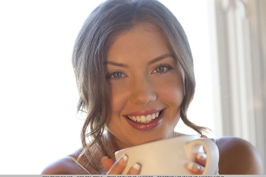 18P Erotic teen Elena Koshka enjoys her coffee with a bare twat in the kitchen