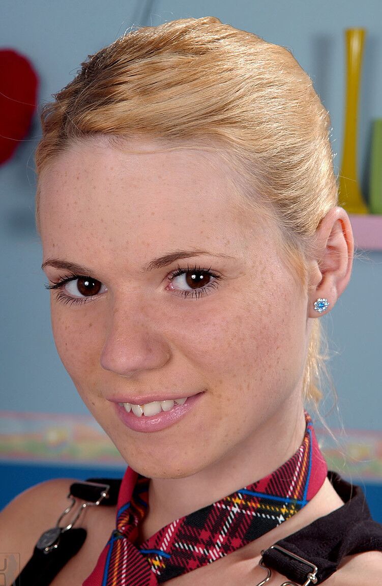 21P Blonde with a freckled face Yasmine Gold undresses and plays with a pink toy