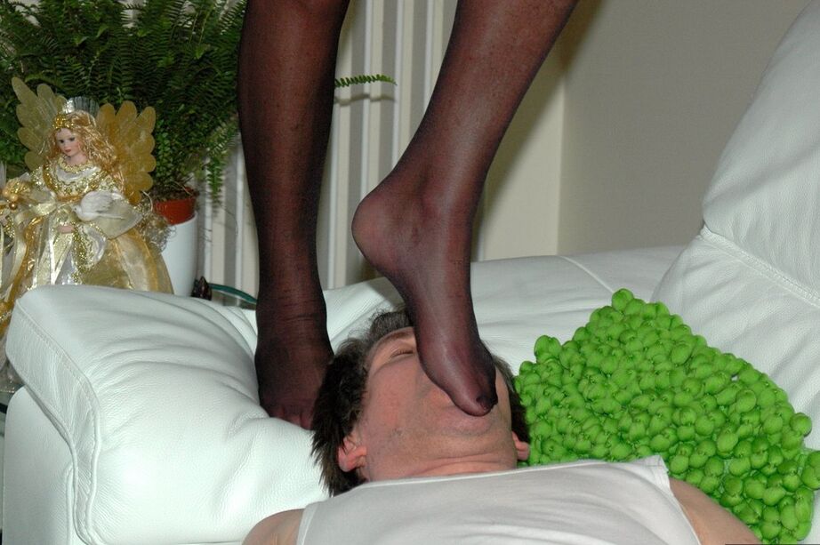 20P Mature blonde tramples a man in nylon clad feet after removing red soled heels