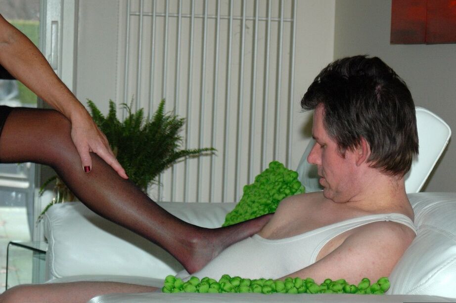 20P Mature blonde tramples a man in nylon clad feet after removing red soled heels