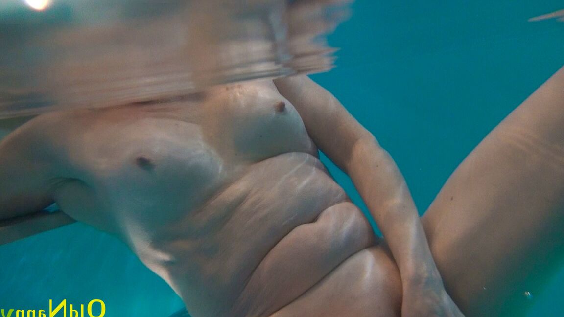 21P Horny granny Jitka masturbating in the pool during a nude swim session