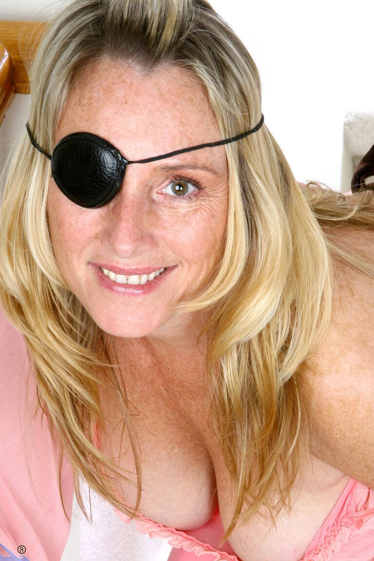 21P Amateur MILF with a blindfold Jordan flaunts her huge juggs on the stairs