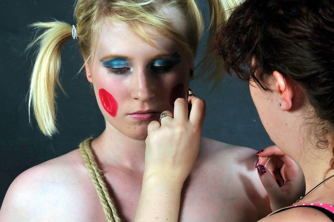 16P Blonde girl is made up like a clown during humiliating lezdom play