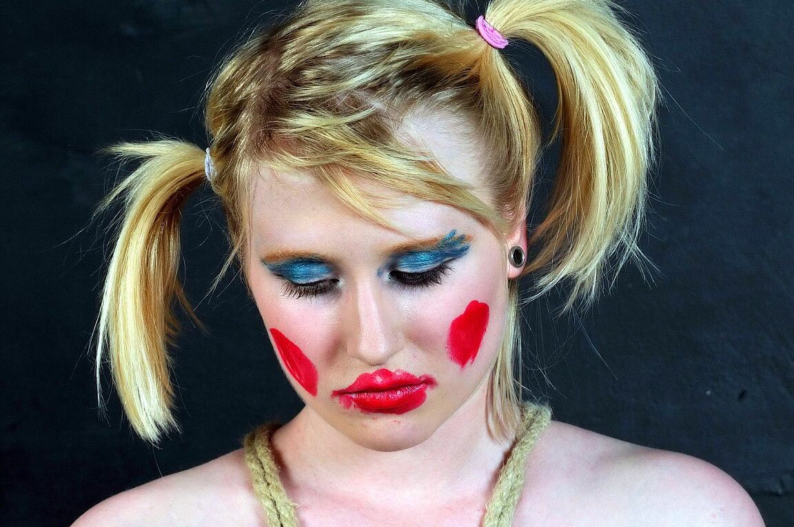 16P Blonde girl is made up like a clown during humiliating lezdom play