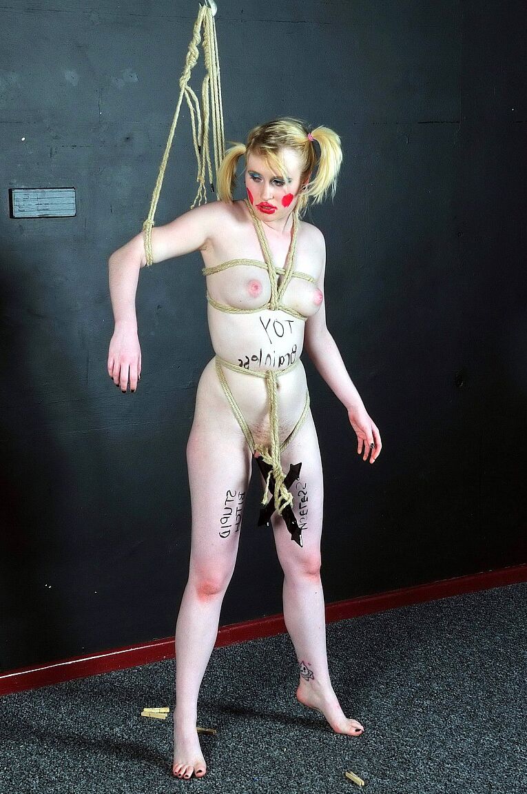 16P Blonde girl is made up like a clown during humiliating lezdom play