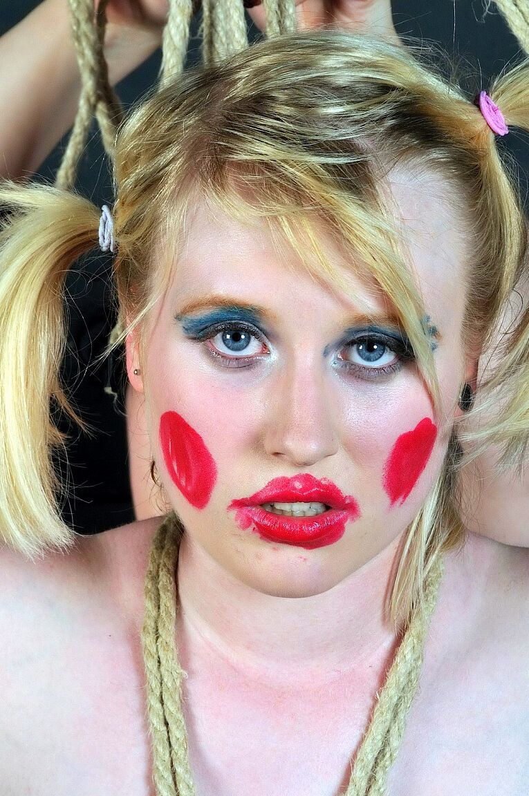 16P Blonde girl is made up like a clown during humiliating lezdom play