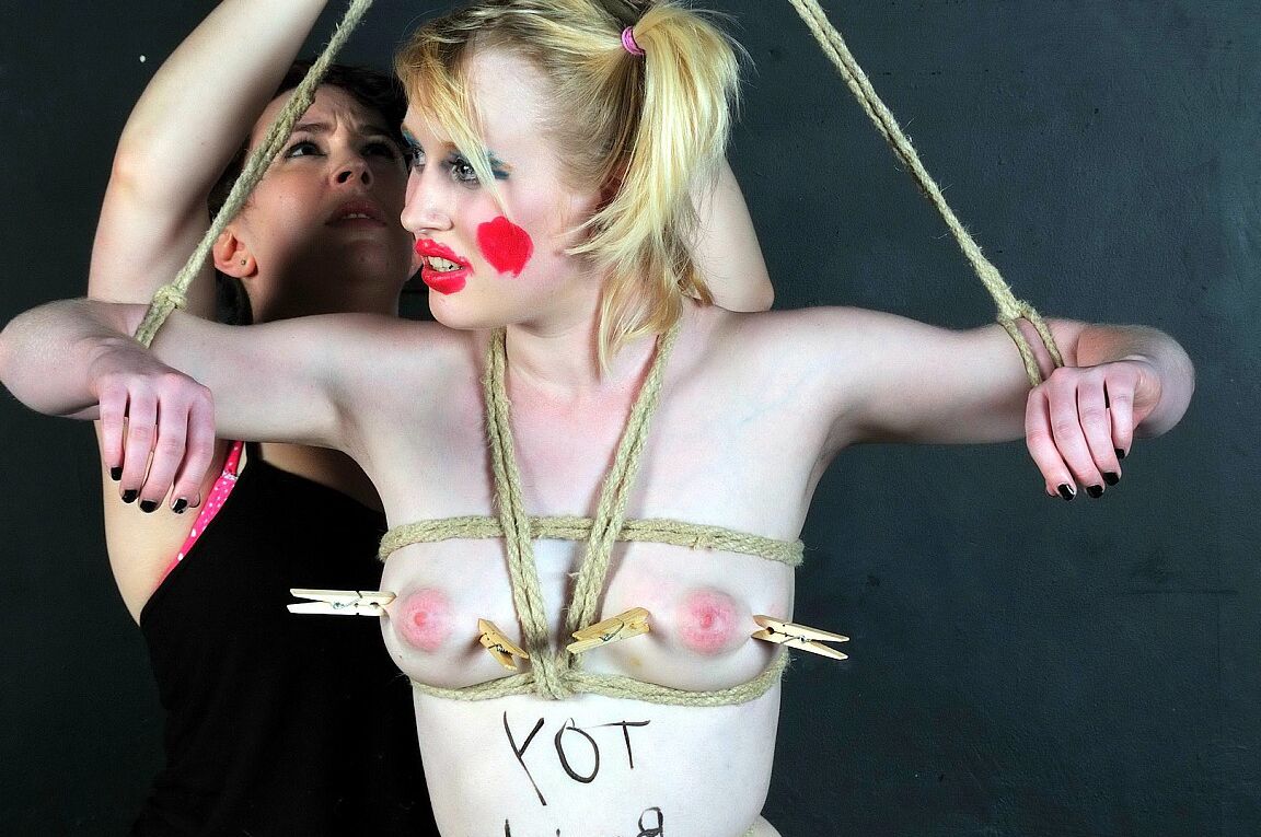 16P Blonde girl is made up like a clown during humiliating lezdom play