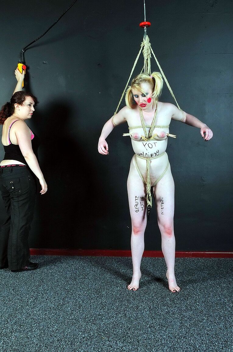 16P Blonde girl is made up like a clown during humiliating lezdom play