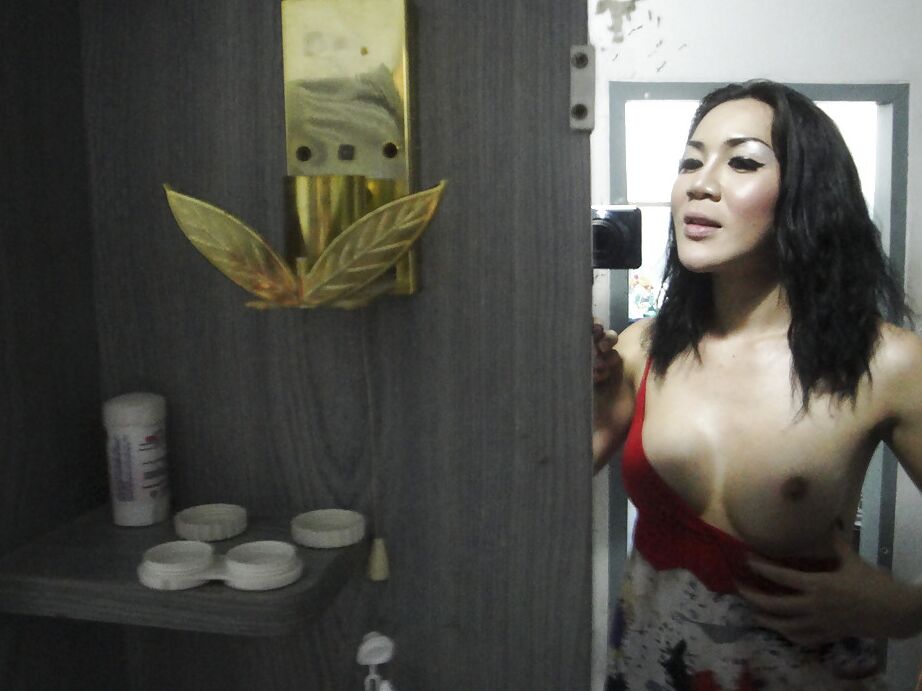 16P Wicked Asian tranny May giving a blowjob to man in public bathroom