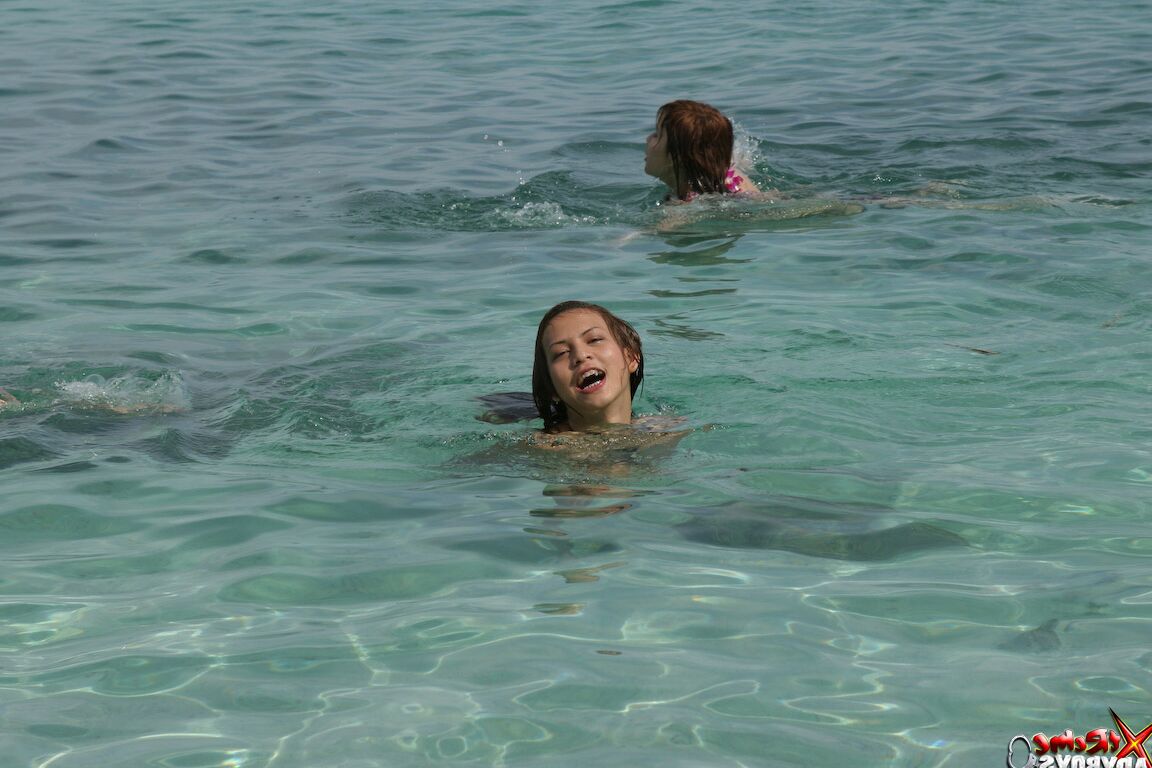 21P Smoking hot shemale babes going topless and posing in the sea water