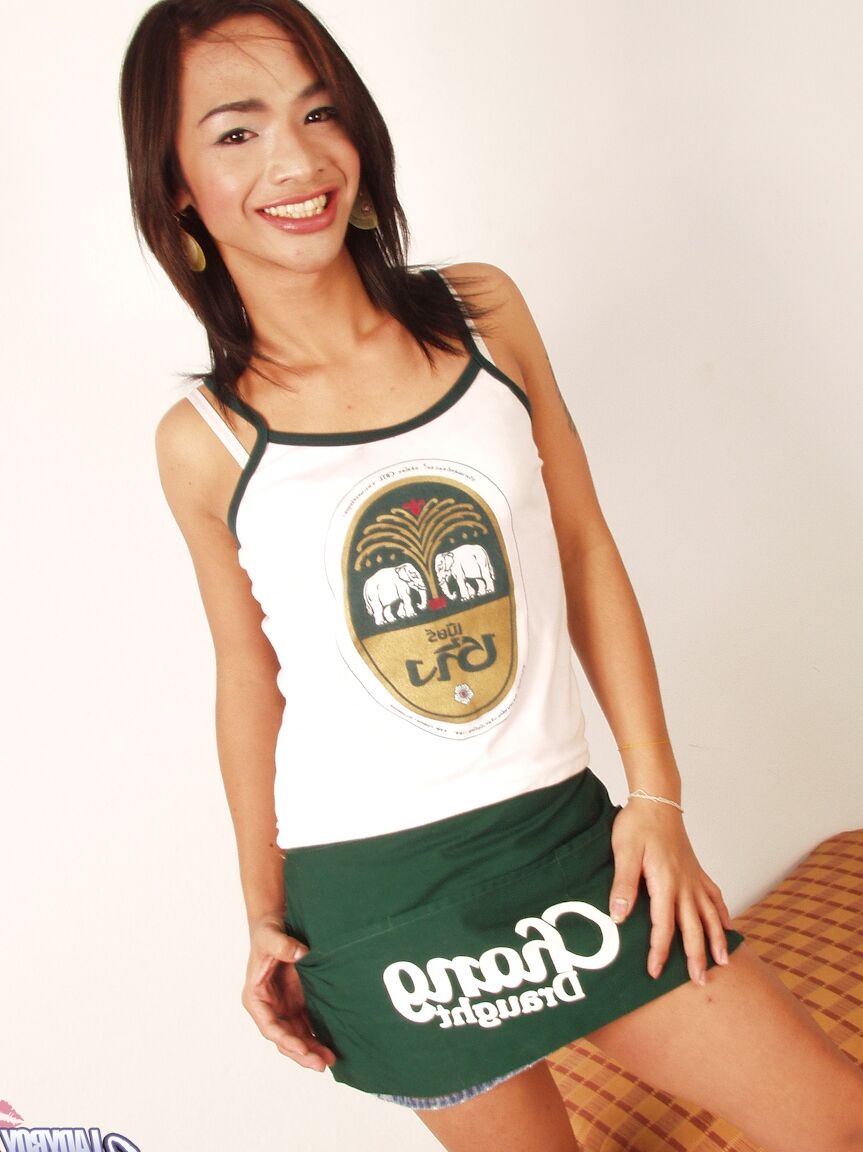 17P Asian shemale Anita exposes her huge dick while drinking beer from a bottle