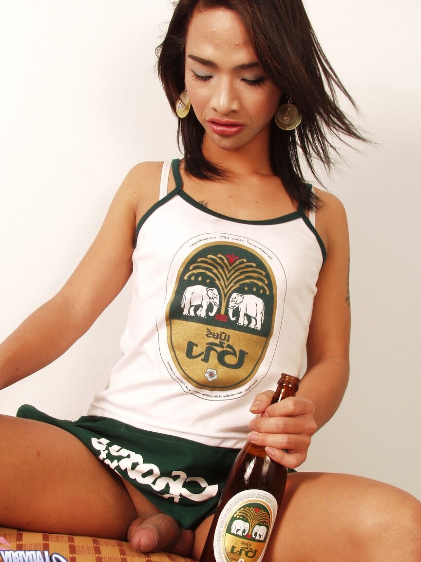 17P Asian shemale Anita exposes her huge dick while drinking beer from a bottle