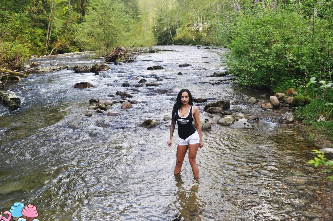 12P Latina teen Cindy Cupcakes pulls down her shorts while standing in a river
