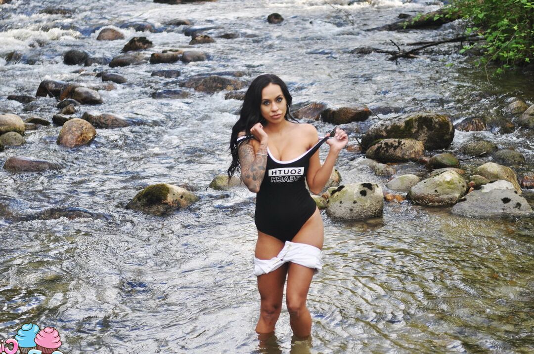 12P Latina teen Cindy Cupcakes pulls down her shorts while standing in a river