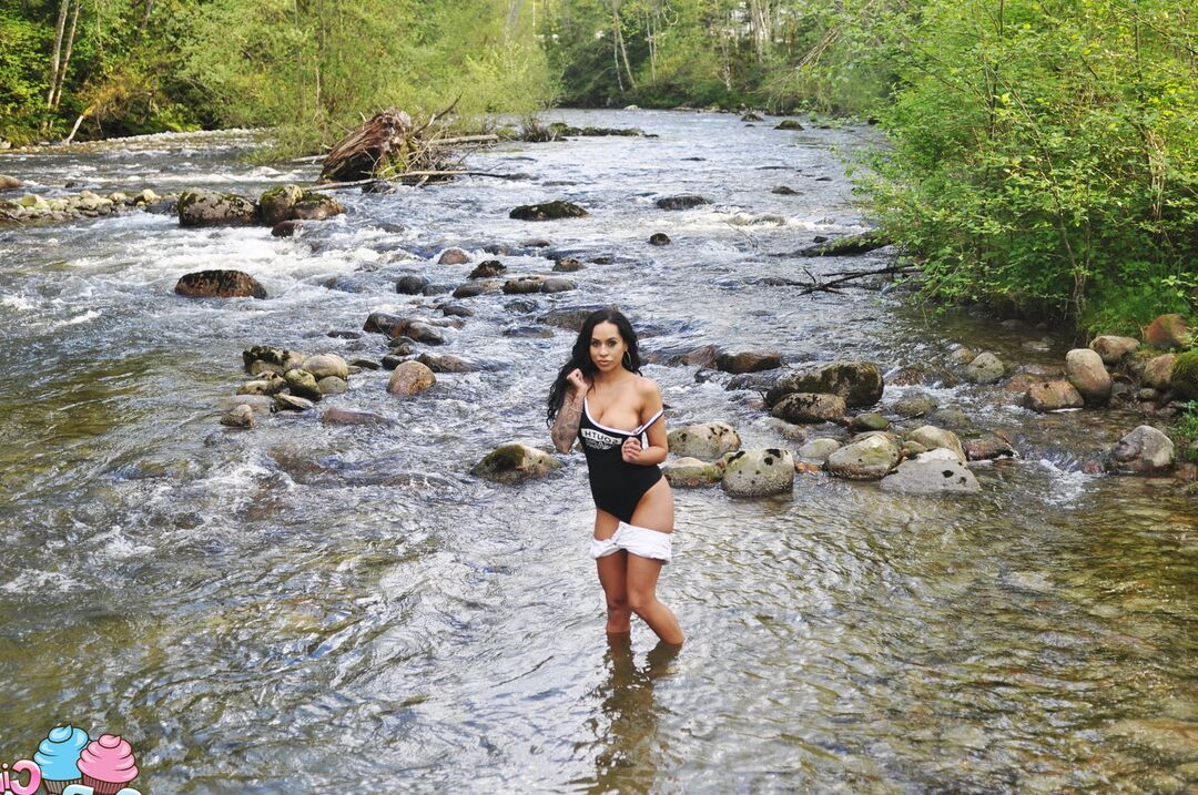 12P Latina teen Cindy Cupcakes pulls down her shorts while standing in a river