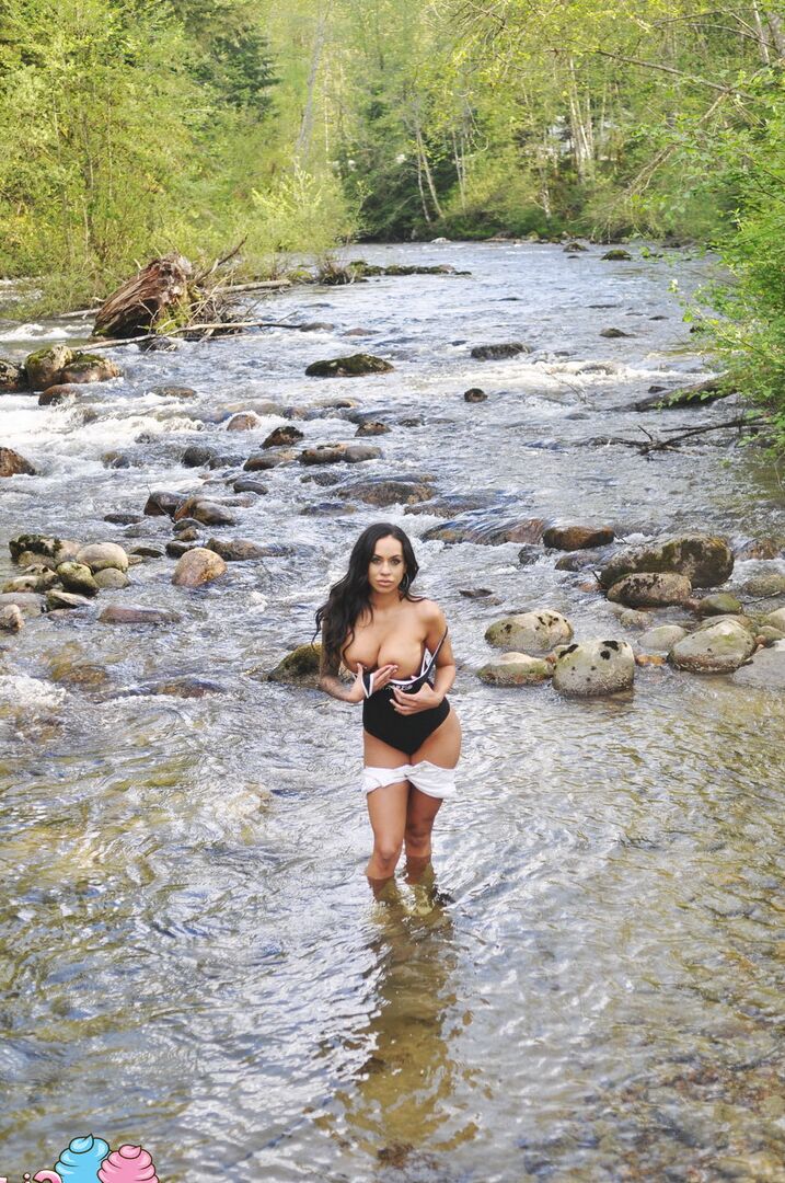 12P Latina teen Cindy Cupcakes pulls down her shorts while standing in a river