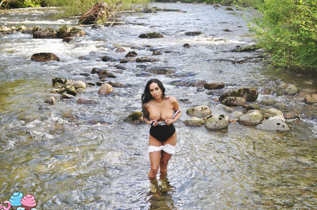 12P Latina teen Cindy Cupcakes pulls down her shorts while standing in a river