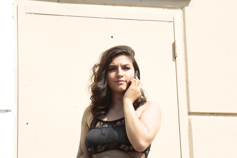 16P Latina model Lucy Deville posing for fully clothed candid shots outdoors
