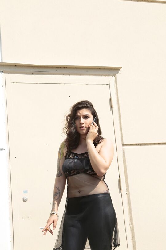 16P Latina model Lucy Deville posing for fully clothed candid shots outdoors