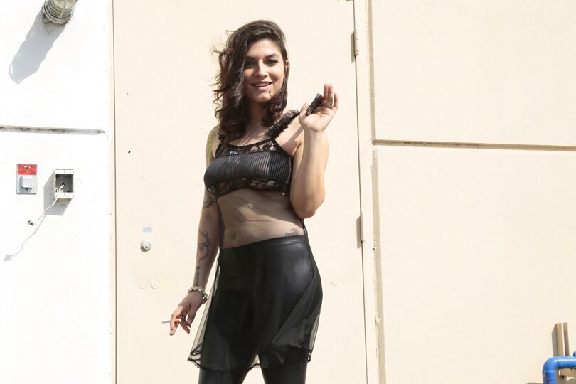 16P Latina model Lucy Deville posing for fully clothed candid shots outdoors