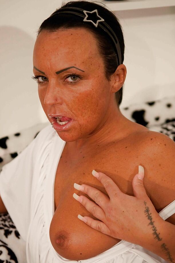 12P Mature Candy Cox flaunting her goodies while wearing designer boots