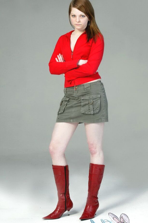 20P Pale redhead Lilly slowly strips to a black G-string and red leather boots