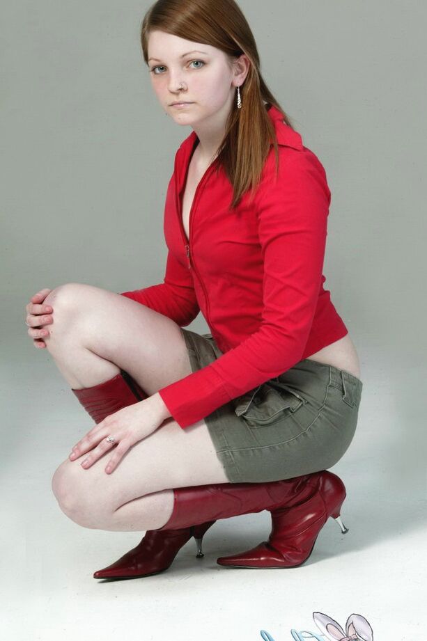 20P Pale redhead Lilly slowly strips to a black G-string and red leather boots