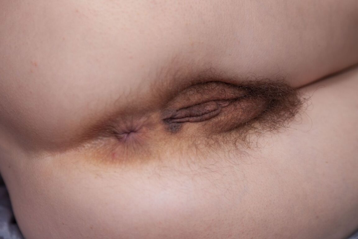 16P Amateur model with hairy underarms and a matching vagina gets naked in boots