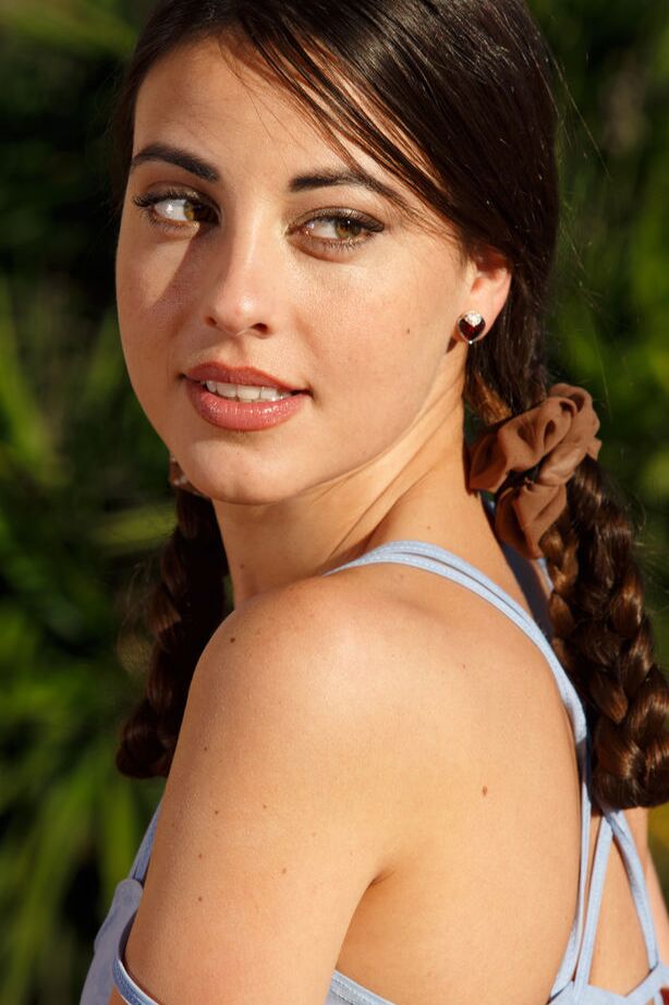 18P Glamour babe Lorena B modeling outdoors in pigtails while baring tiny tits