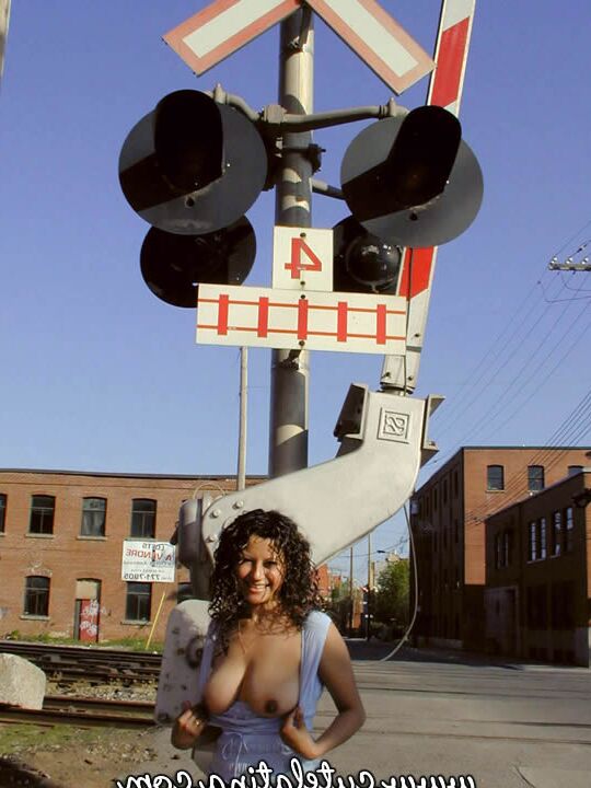 15P Latina amateur Talia exposes herself while walking railway tracks in the city