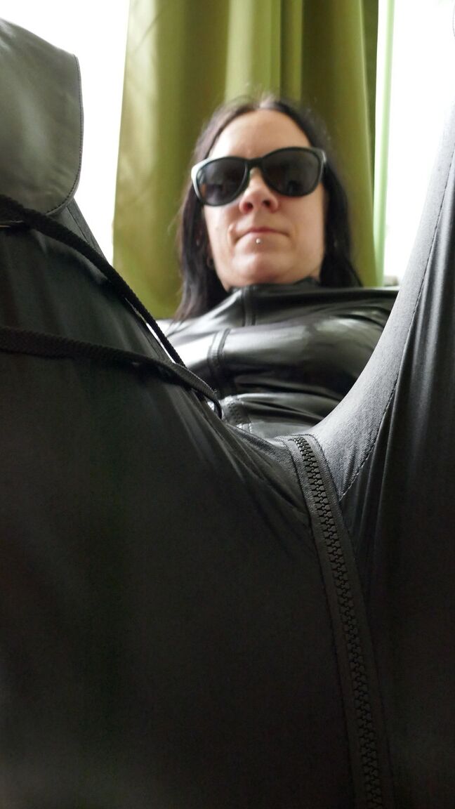 16P Dark haired amateur models a leather catsuit while wearing dark sunglasses