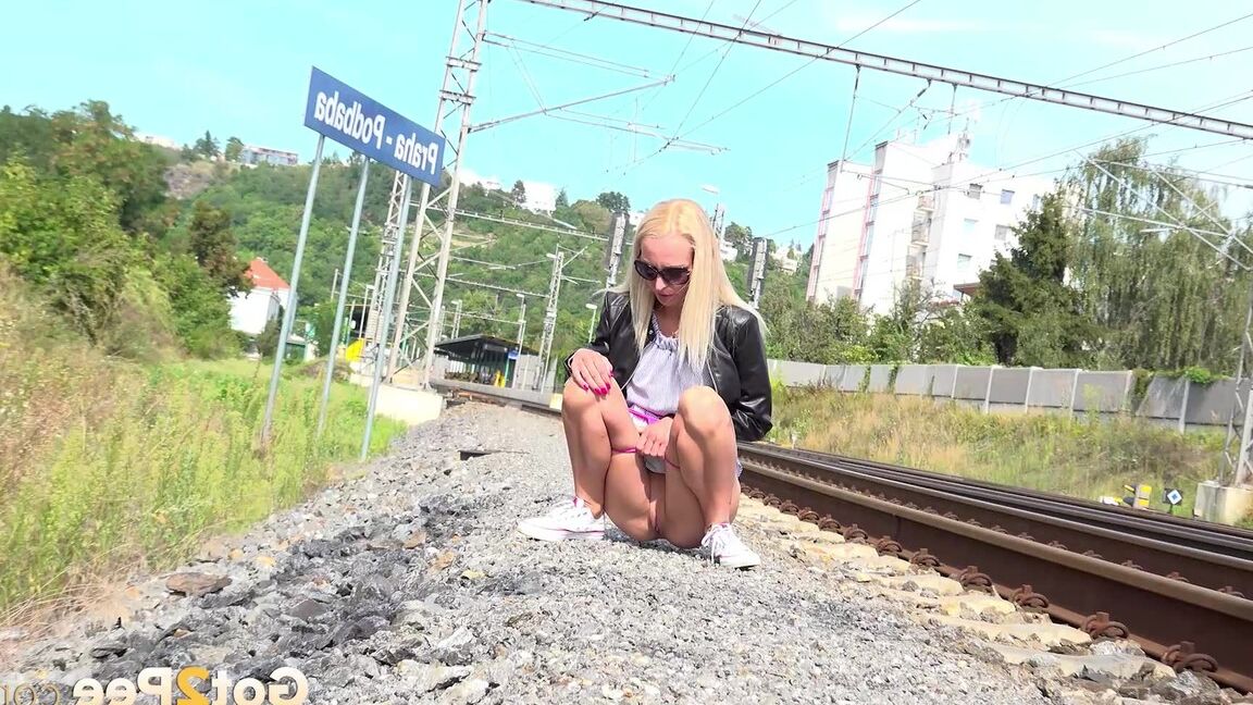 15P Blonde babe Debora pees next to railway line