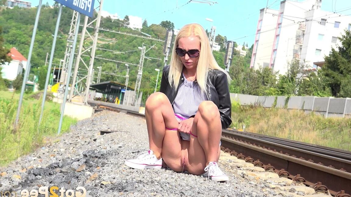 15P Blonde babe Debora pees next to railway line