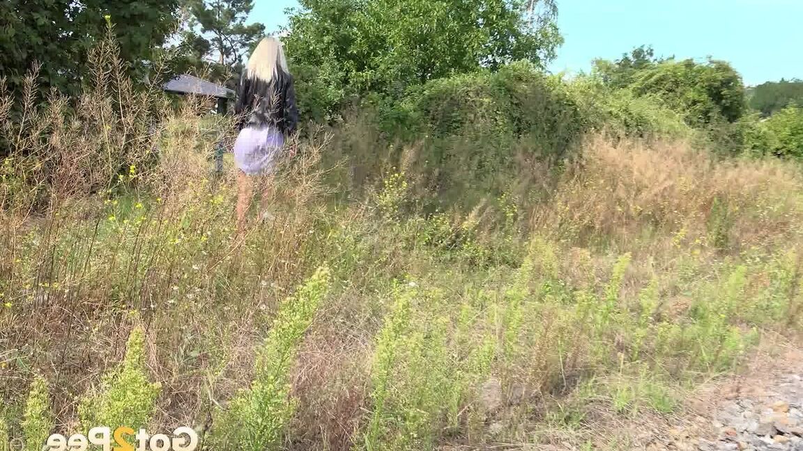 15P Blonde babe Debora pees next to railway line