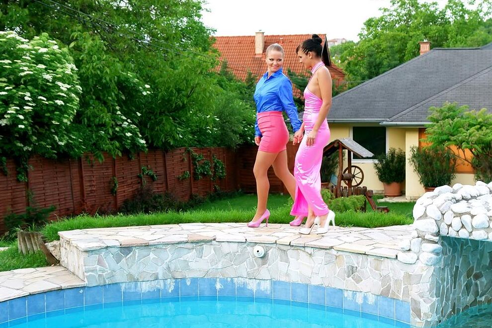 15P Fully clothed women partake in lesbian foreplay while in a swimming pool